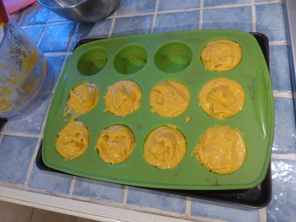 A silicon muffin tray filled with mesturet mixture.