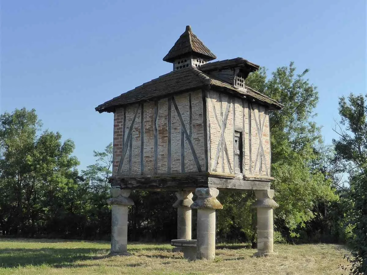 A pigeonnier (or dovecote) stands on four pillars in the village of Saint Paul-Cap-de-Joux.
