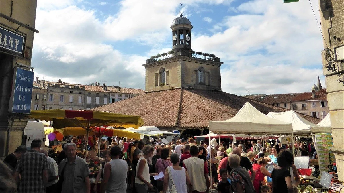 The market square and market hall of Revel on market day.