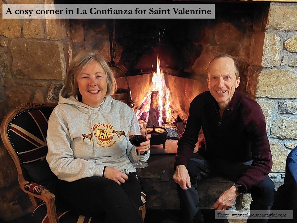Author Colin Duncan Taylor and his wife by the fireside in the restaurant of La Confianze, Puigcerda.