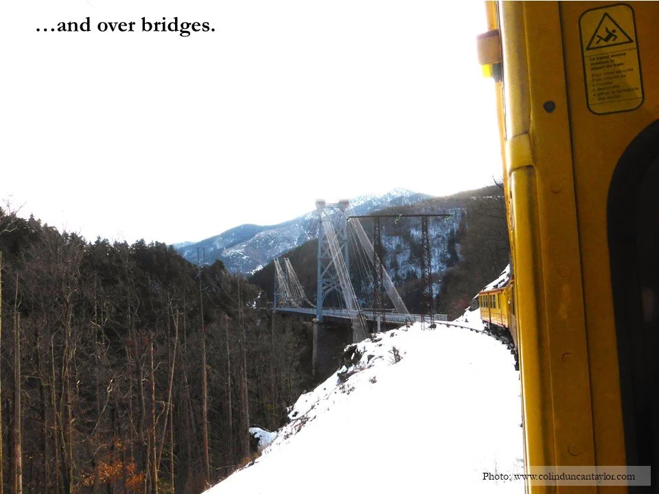 Le Train Jaune prepares to cross a bridge on its way through the French Pyrenees.