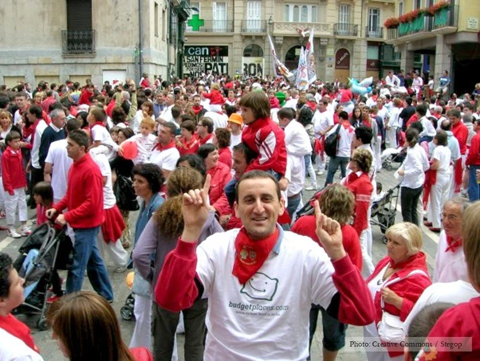 A crowd of people wearing red scarves at Pamplona's festivan of San Fermin.