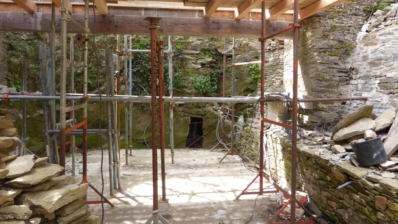 The dark rectangular hole in the back wall of the ice house was to drain meltwater.