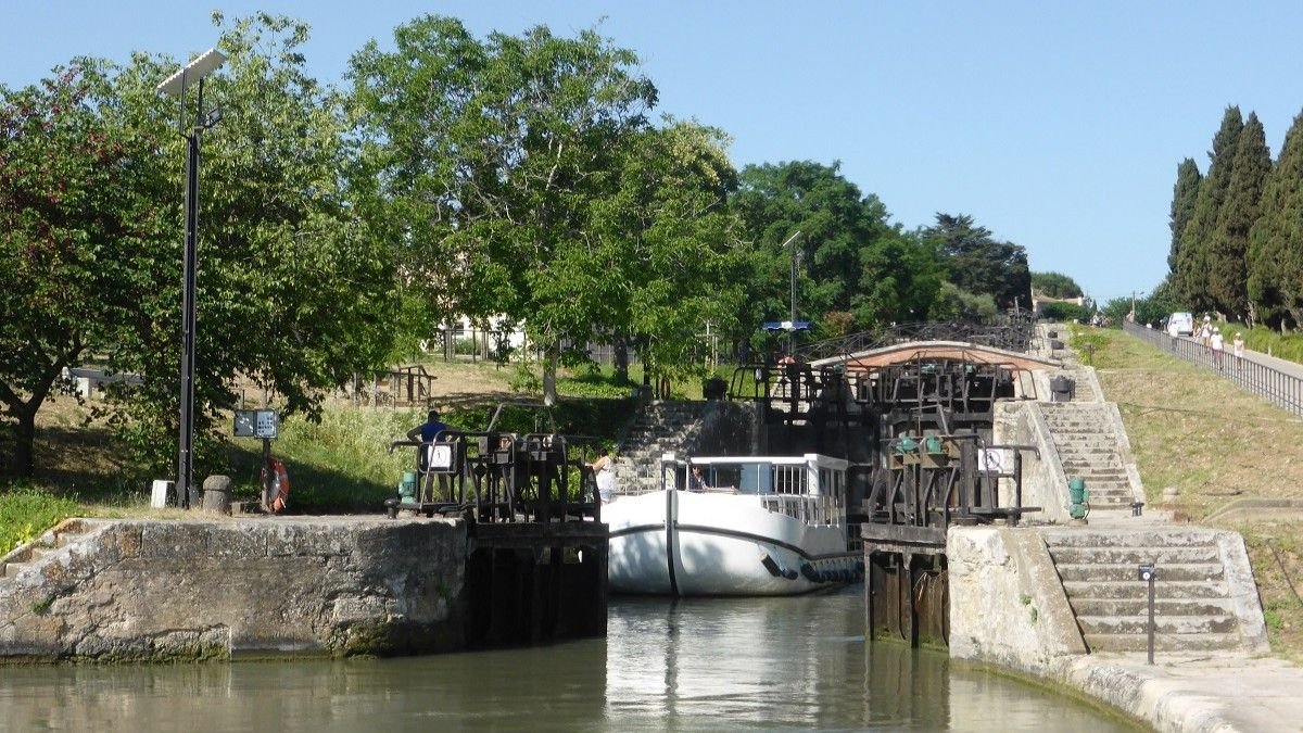 A boat leaves the lowest lock at Fonsérannes on the Canal du Midi.
