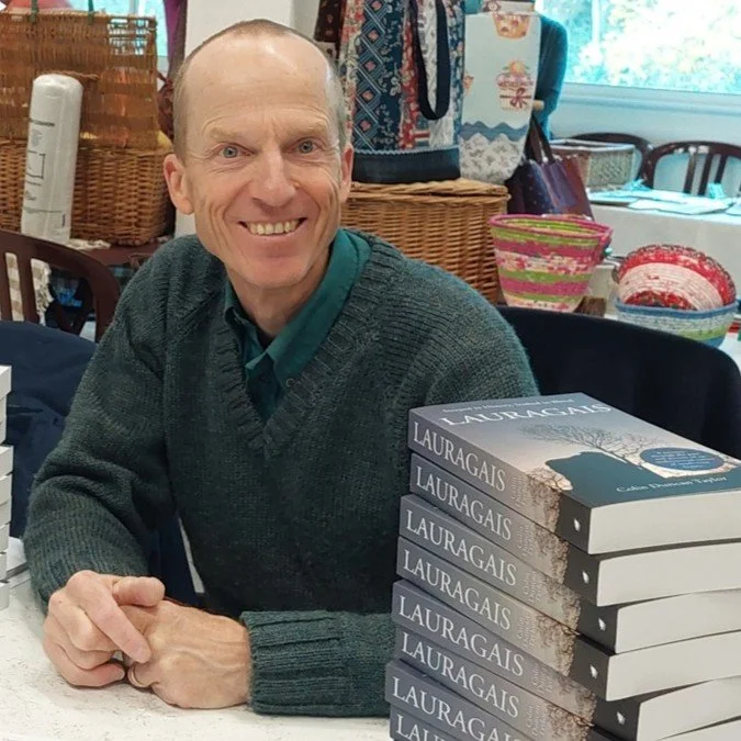 Author Colin Duncan Taylor at a book signing event.