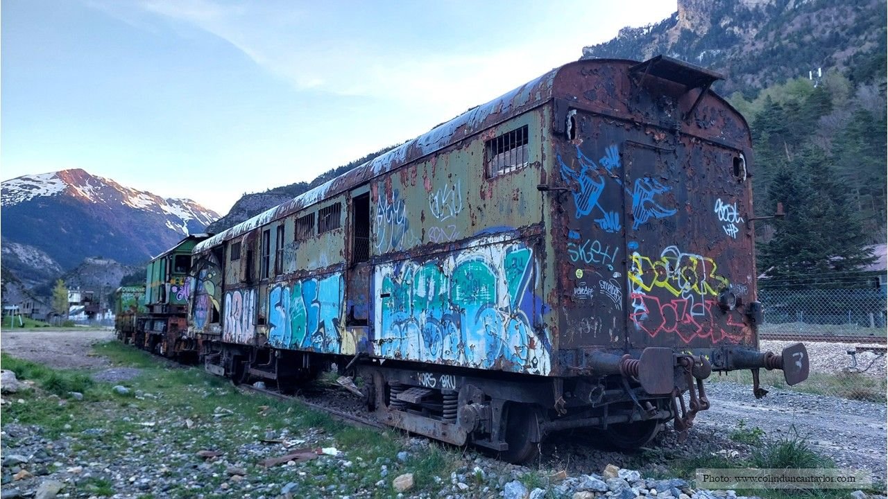 Disused railway carriages rust away in the cold mountain air at Canfranc.