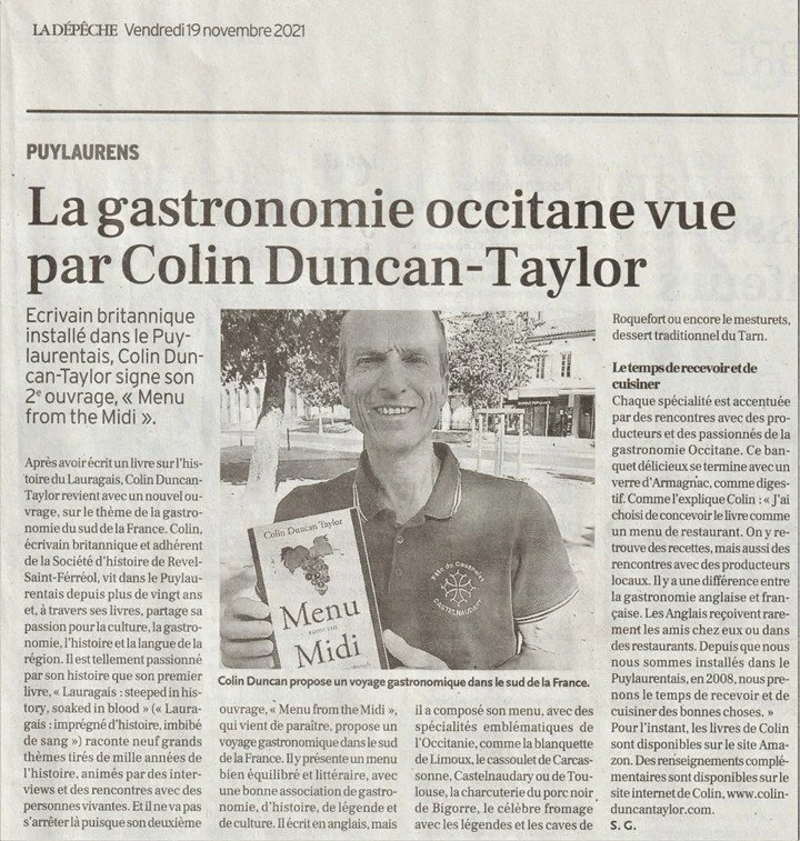 Newspaper article with a photo of a man holding a menu, discussing his gastro culinary journey in southern France.