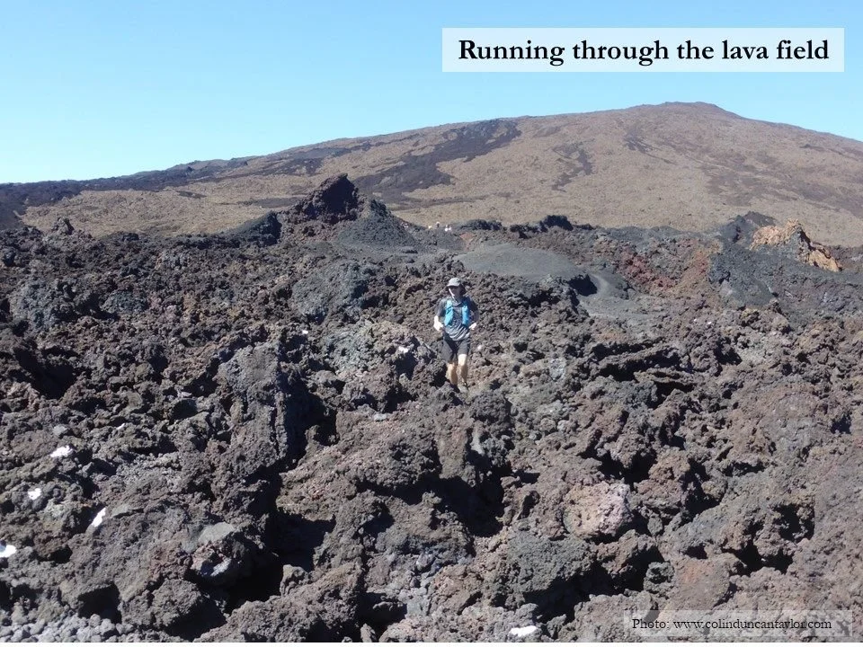 Author Colin Duncan Taylor running through a lava field near the Piton de la Fournaise on the island of La Réunion.