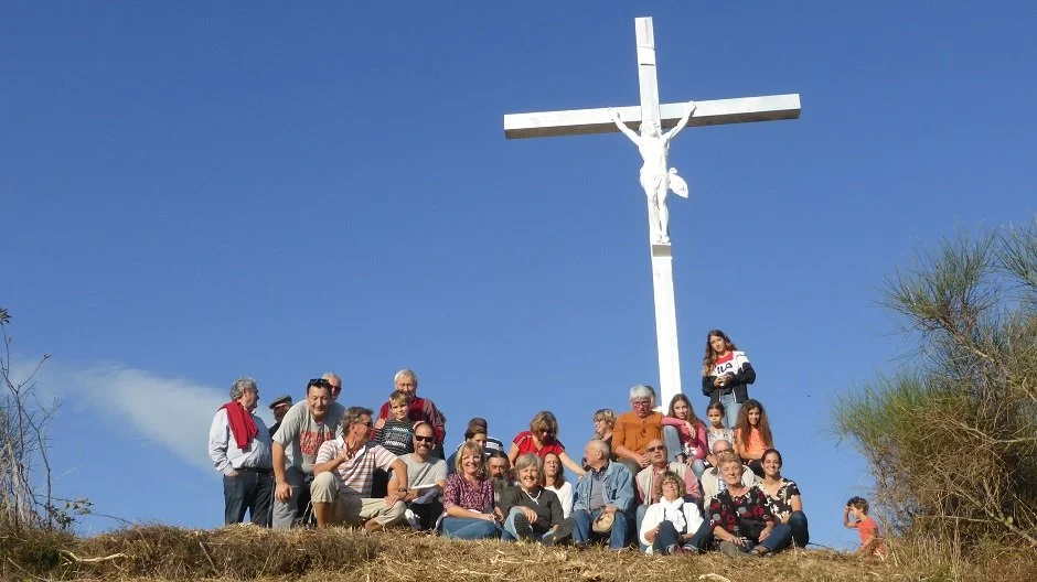 The villagers of Saint Sernin-les-Lavaur pose for a group photograph at the cross above their village.