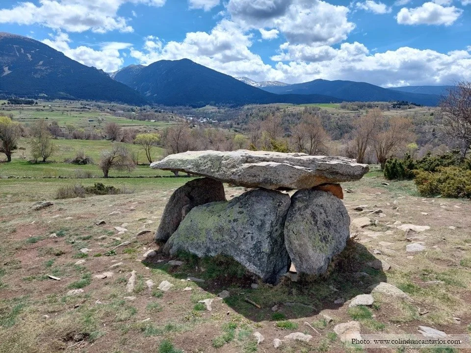 The Dolmen d'Els Pascarets viewed against Pyrenean peaks in the Cerdagne.