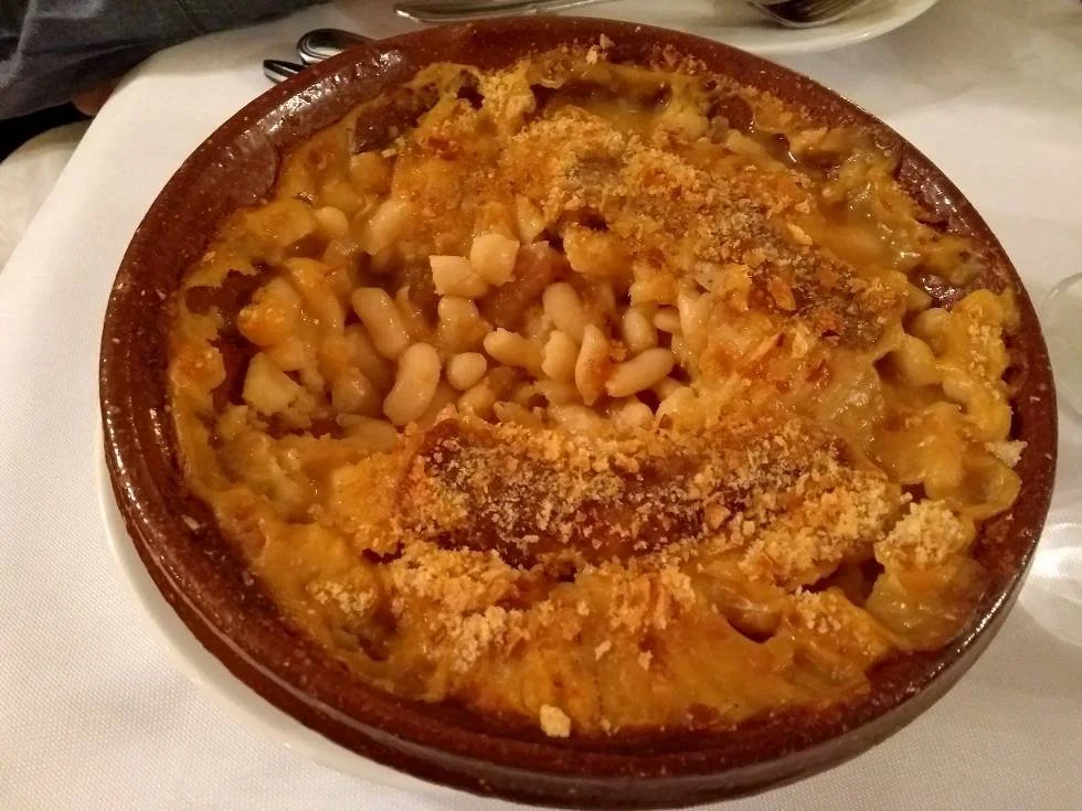 A dish of cassoulet, a traditional bean stew that originated in Castelnaudary.