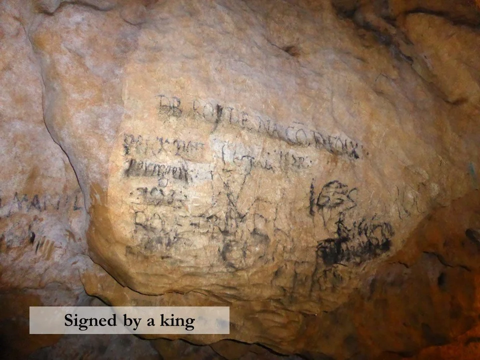 The signature of the future King Henri IV of France deep inside the Grotte de Lombrives.
