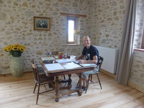 Author Colin Duncan Taylor editing one of his books.