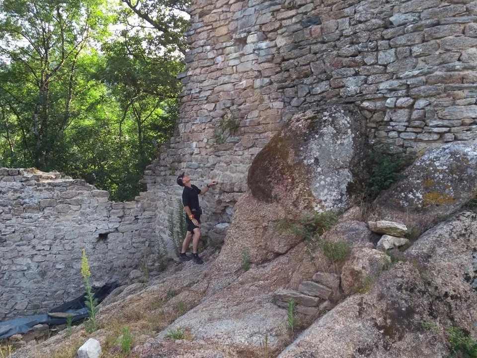 Author Colin Duncan Taylor inspects the keep in the fortified village of Roquefort in the Montagne Noire.