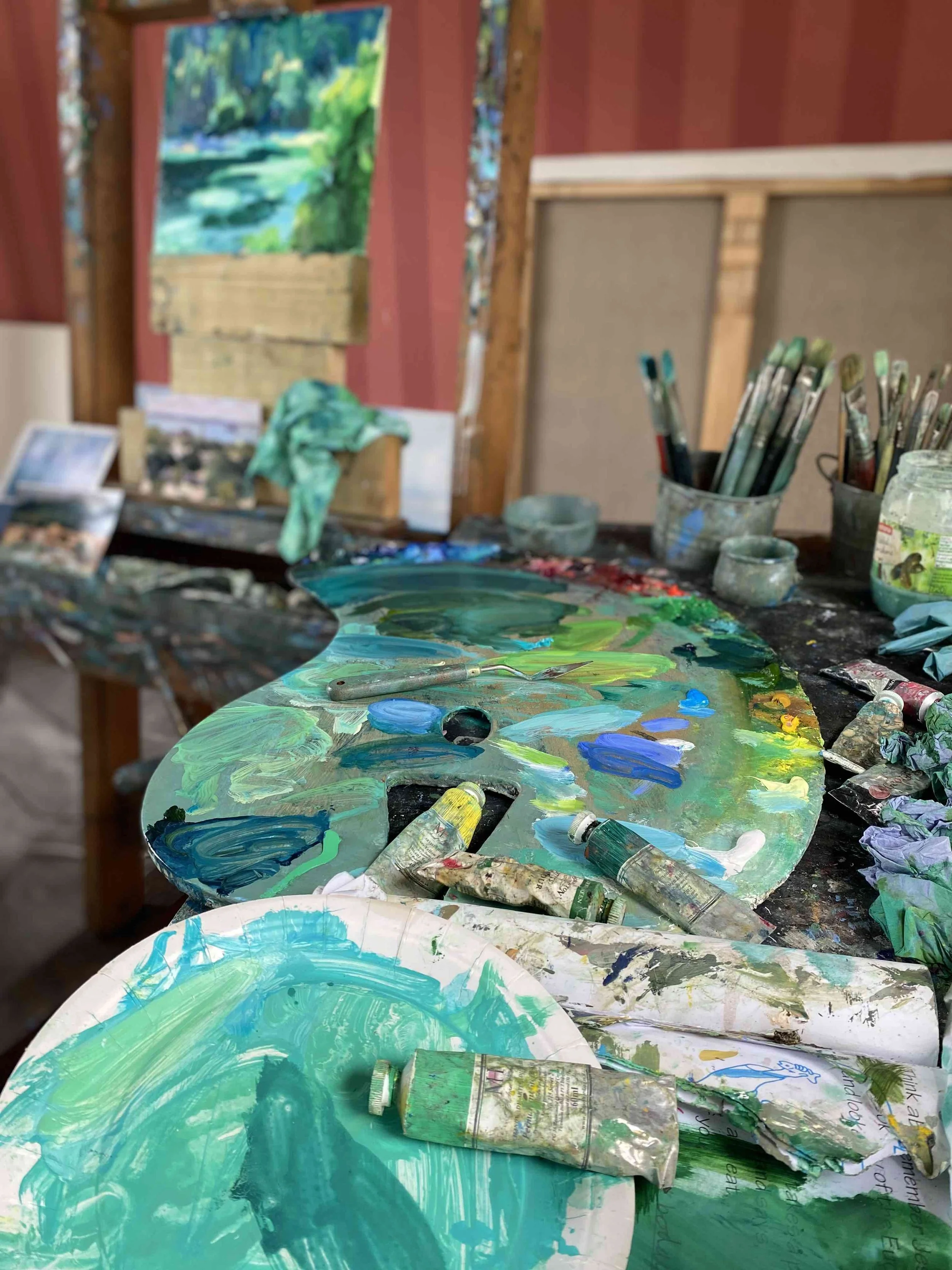 artist henrietta jordan's painting studio with art on an easel