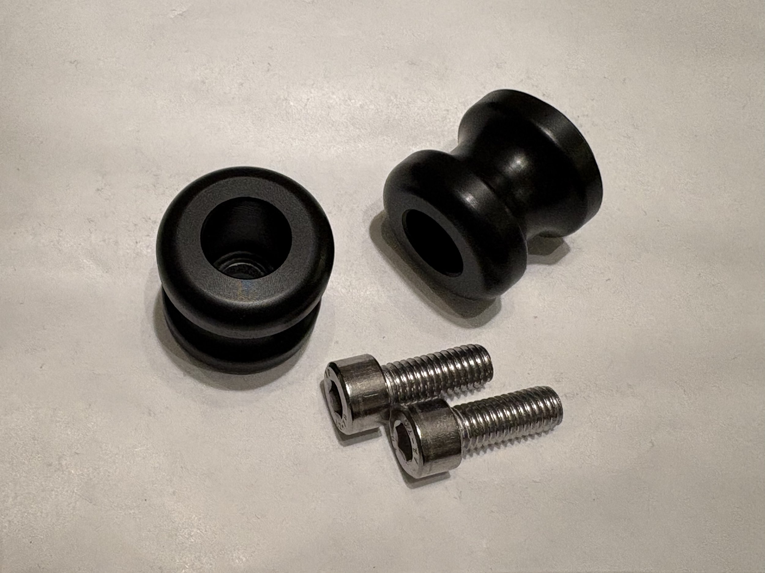PITBIKE CRASH LIFTING BOBBIN SLIDER 29MM X 28MM M8 BOLTS 2.jpeg