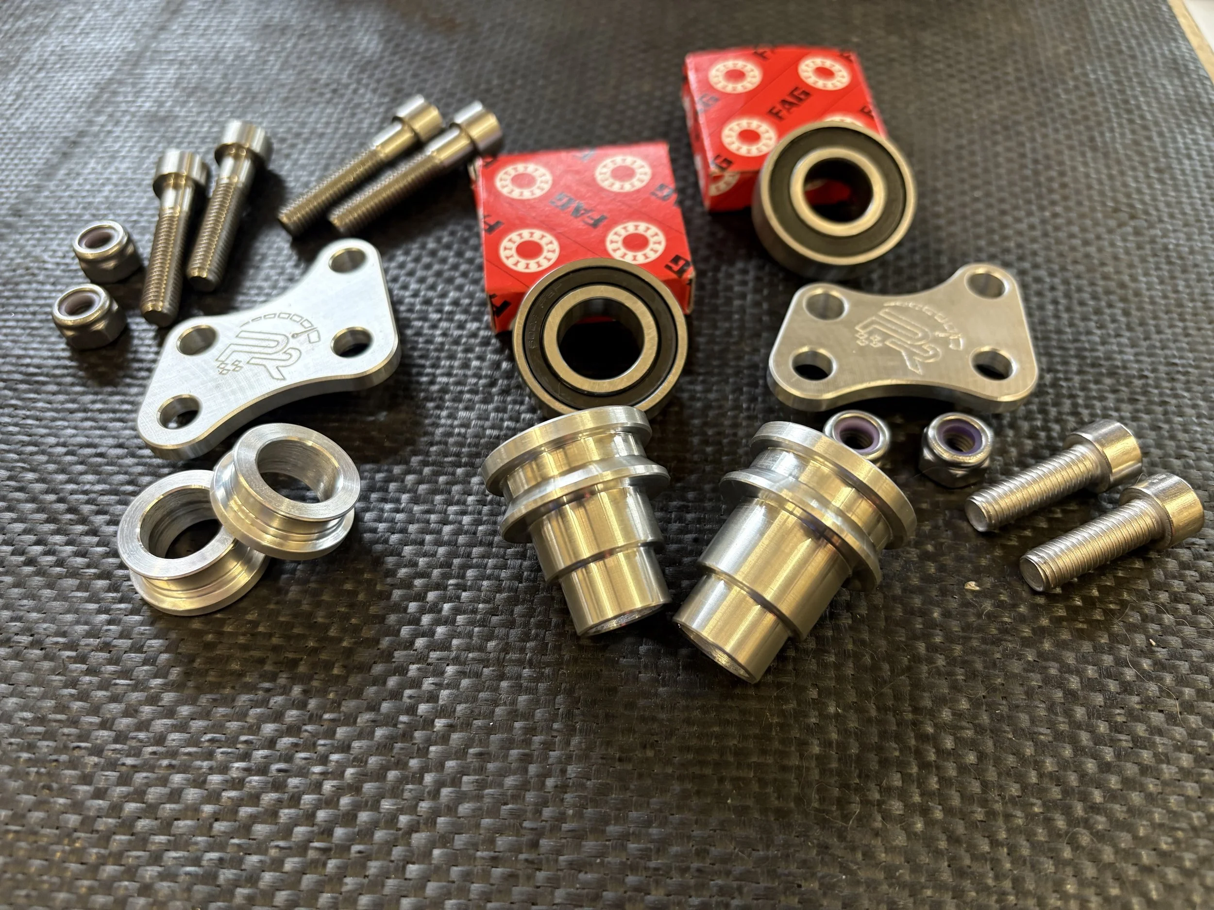 Complete Symoto front and rear wheel conversion kit for KTM 65, Husqvarna TC65 and GasGas MC65 with captive spacers, bearings and brake adapters. (Copy)