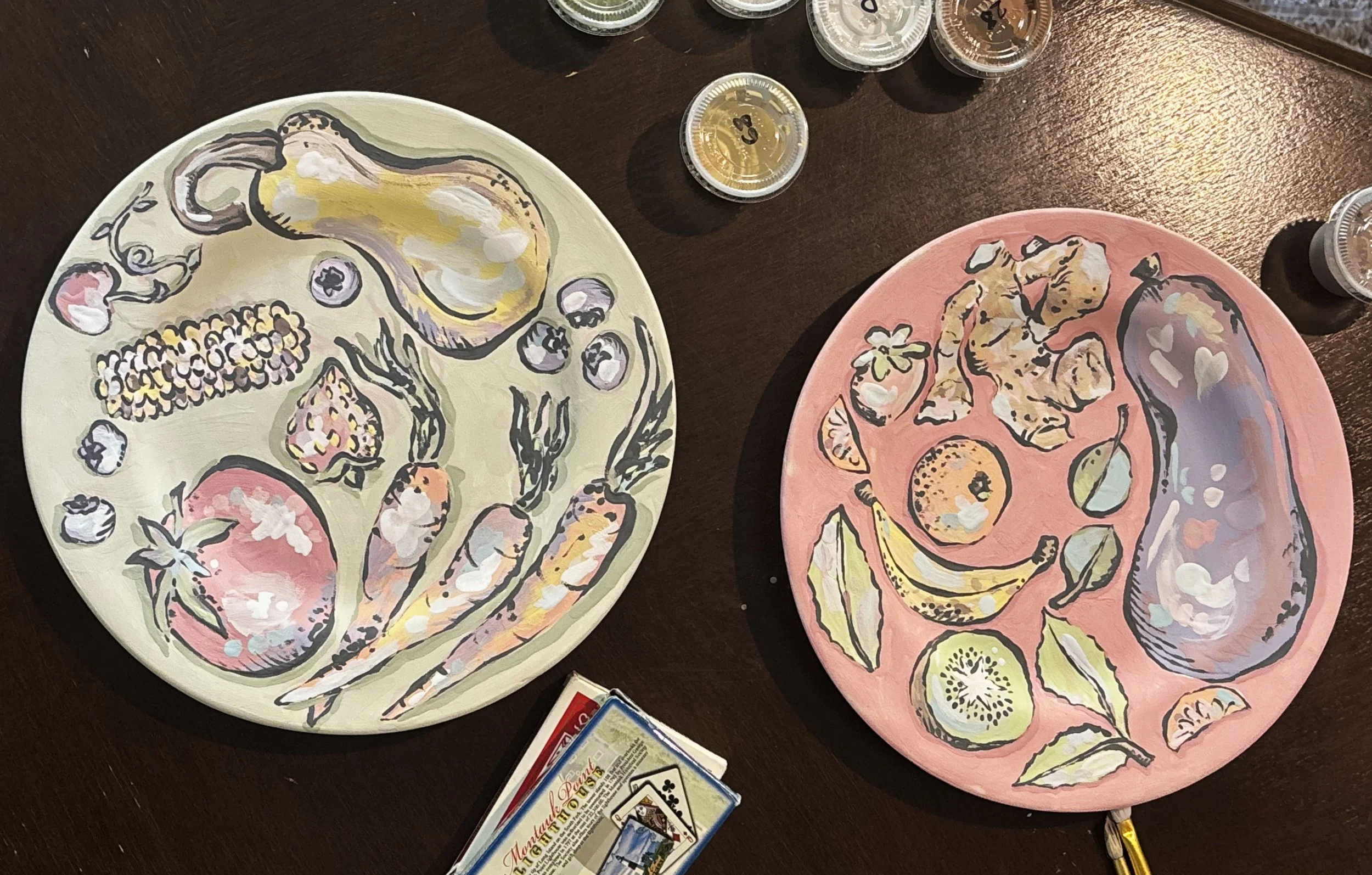 "Produce Plates", 1 of 2. This set of plates features produce from a specific area and follows the same painting technique as the "Ocean Gifts" platter. 