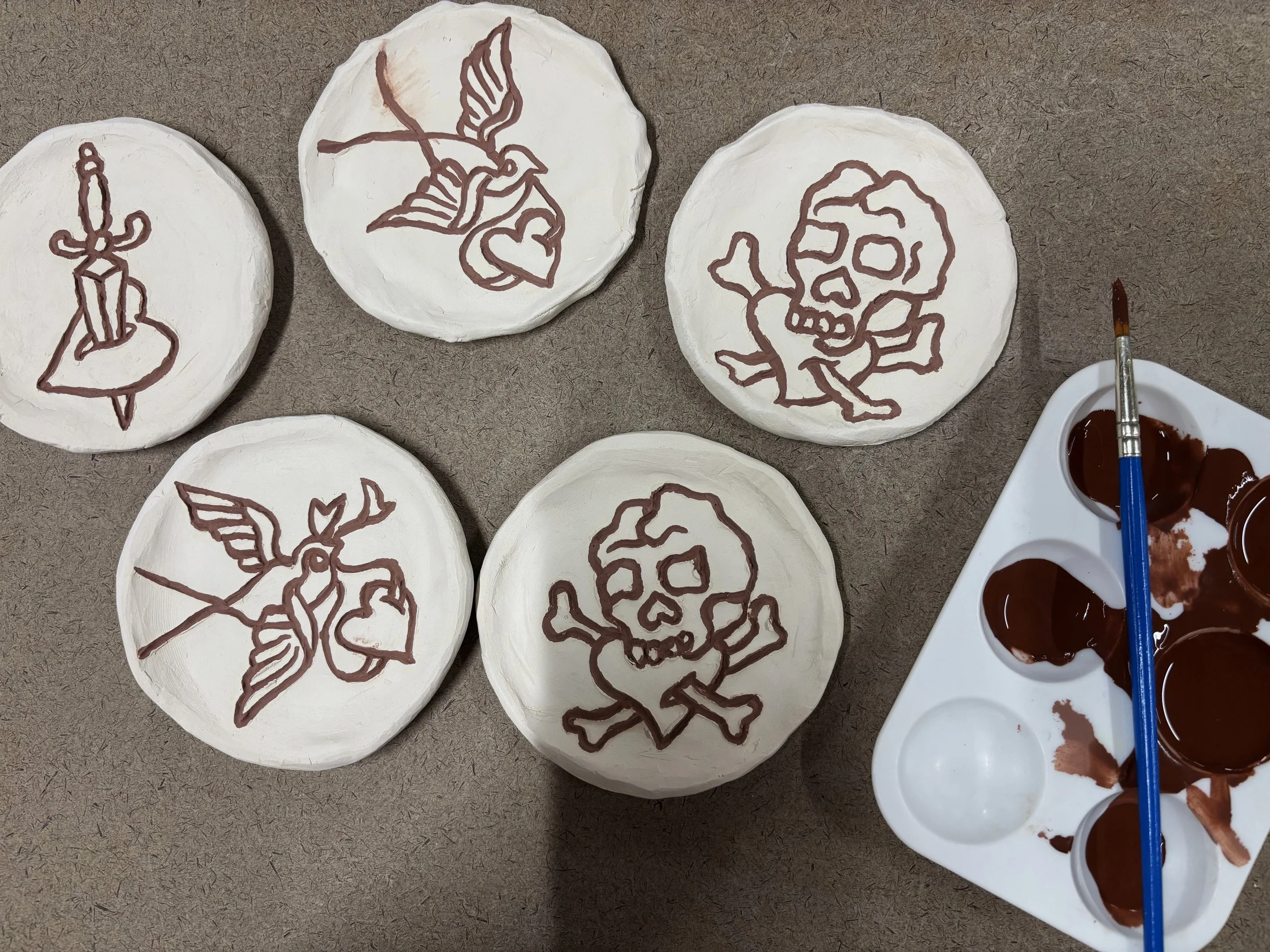 Valentine's saucers, 1 of 2. These are inspired by Sailor Jerry flash with the designs carved in. 