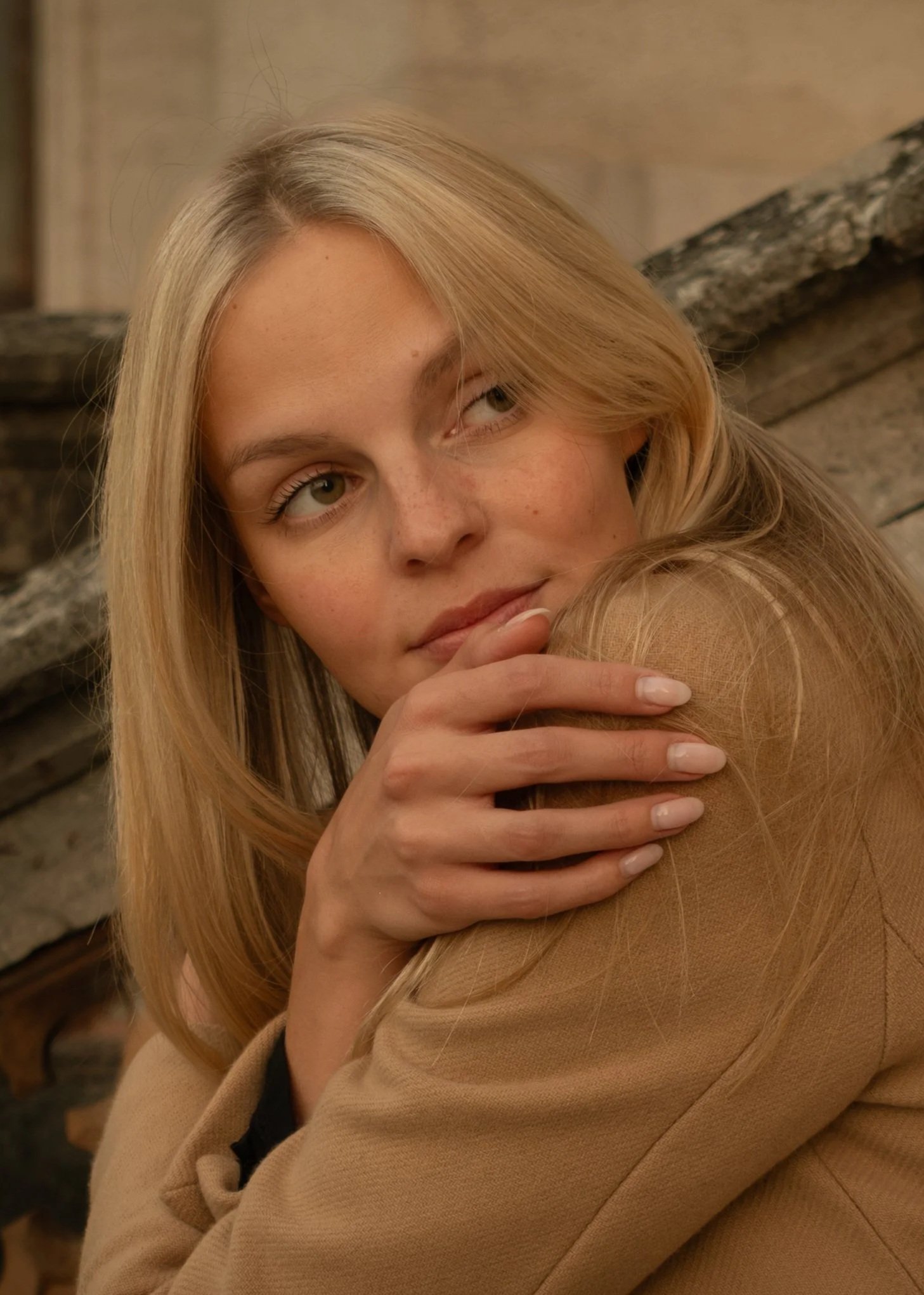 Portrait of a woman with blonde hair, photographed by Skye J Blount.