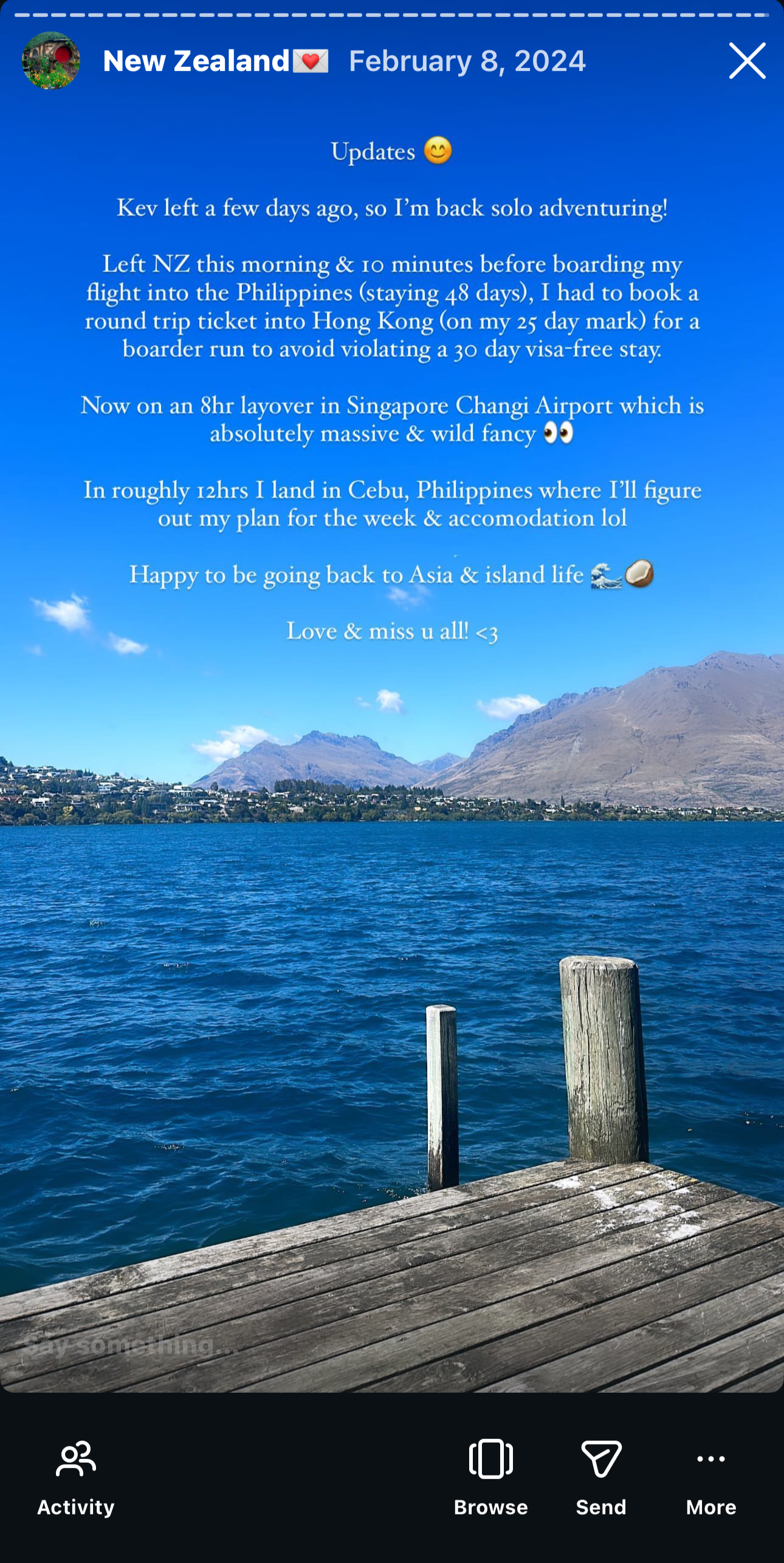 A scenic photo of a lake with mountains in the background and a wooden dock in the foreground.