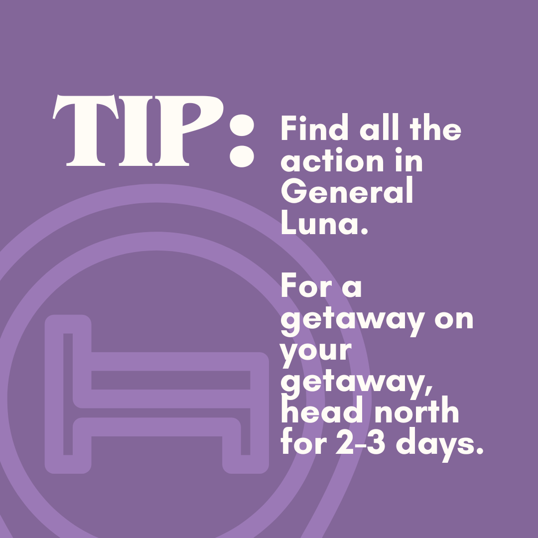 Purple informational graphic with a stylized bed icon. Text provides a tip to find an action in General Luna for a getaway, suggesting to head north for 2-3 days.