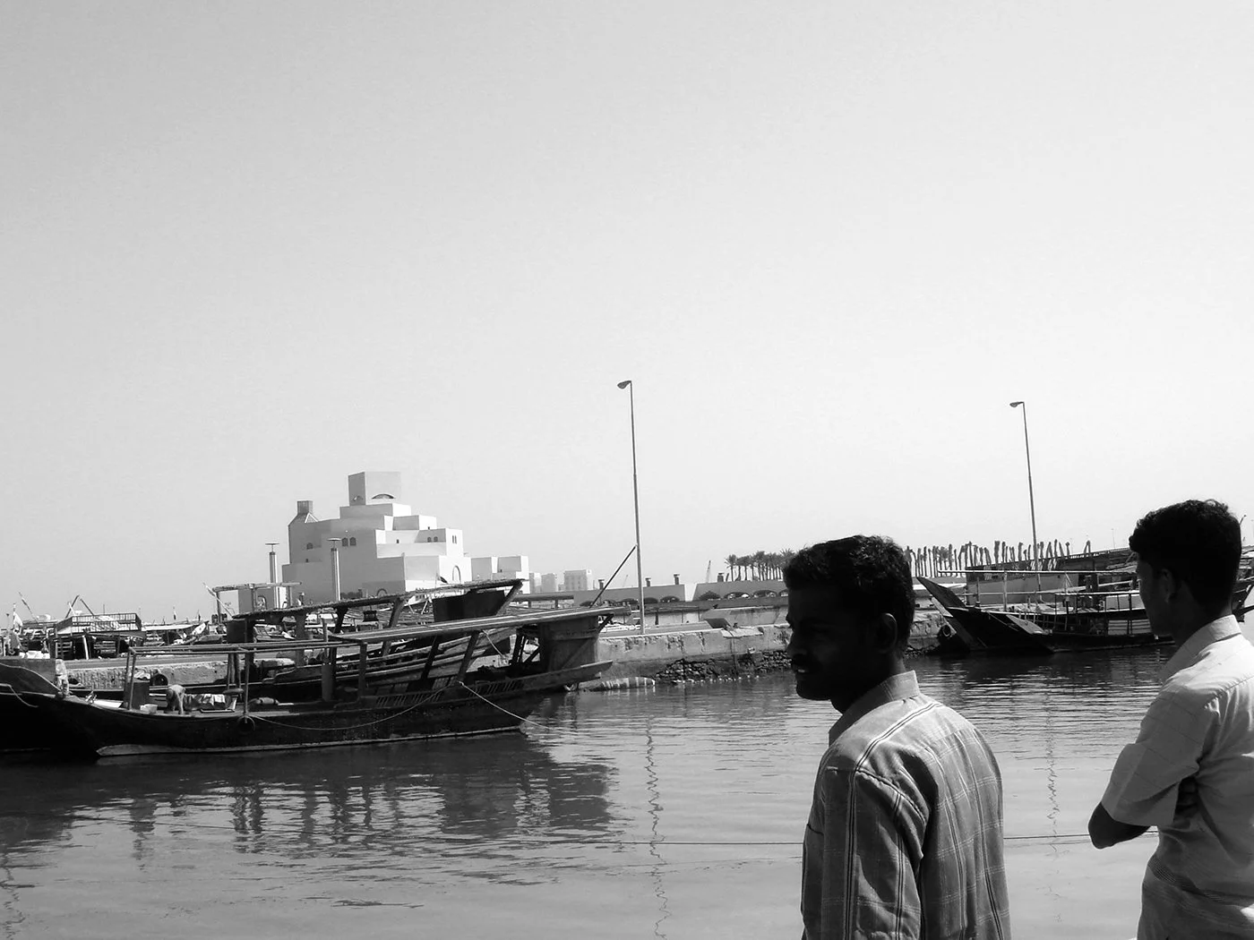 Migrant workers observing the Museum of Islamic Art. 2007