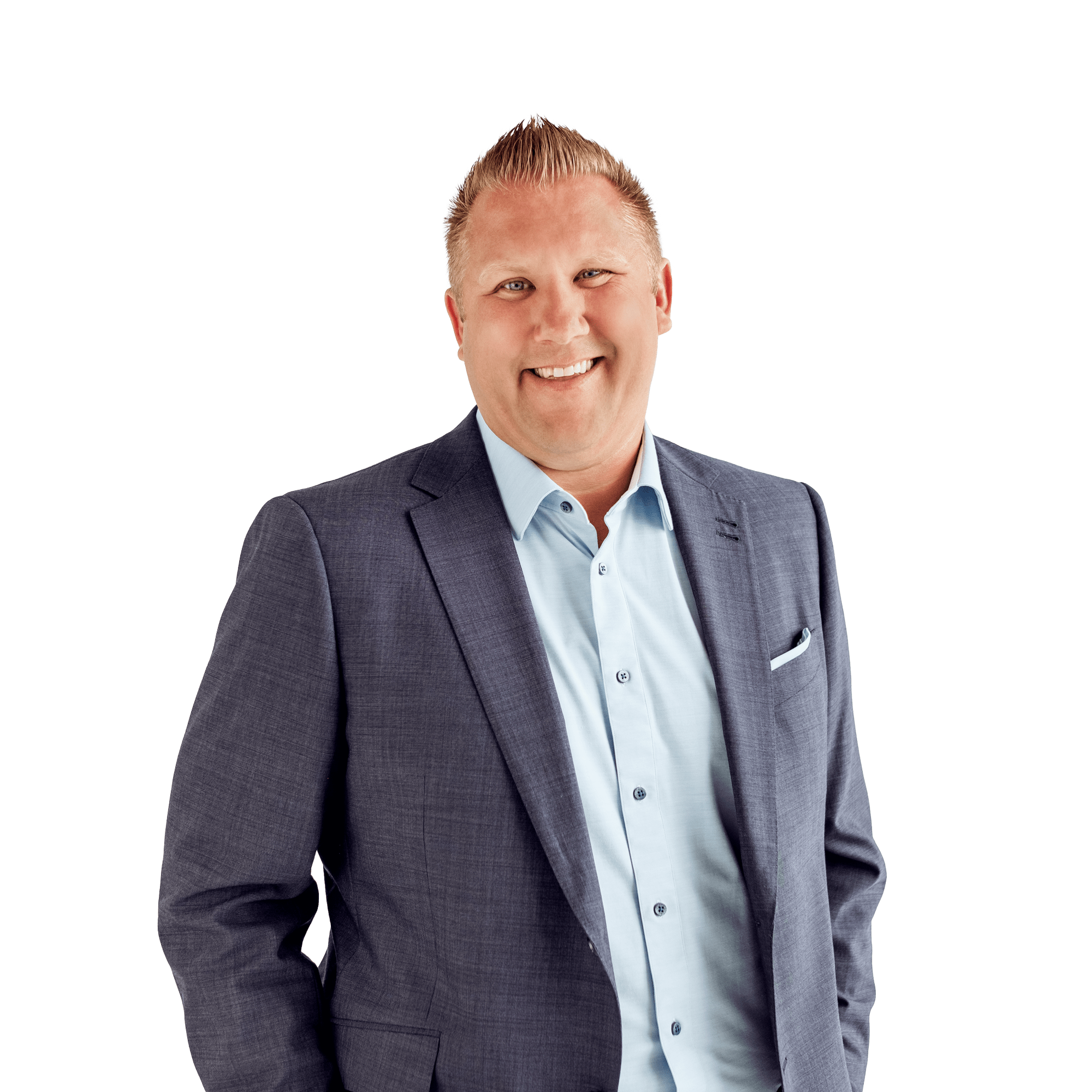 A cheerful man with blond hair in a suit smiling at the camera, white background.