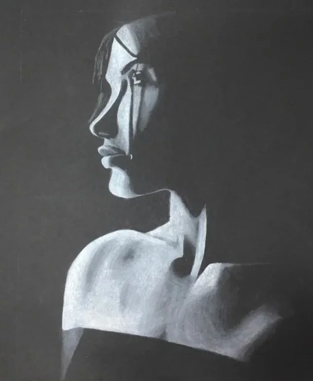 Black and white art of a woman's profile with a contemplative expression, blending into the shadowy background.