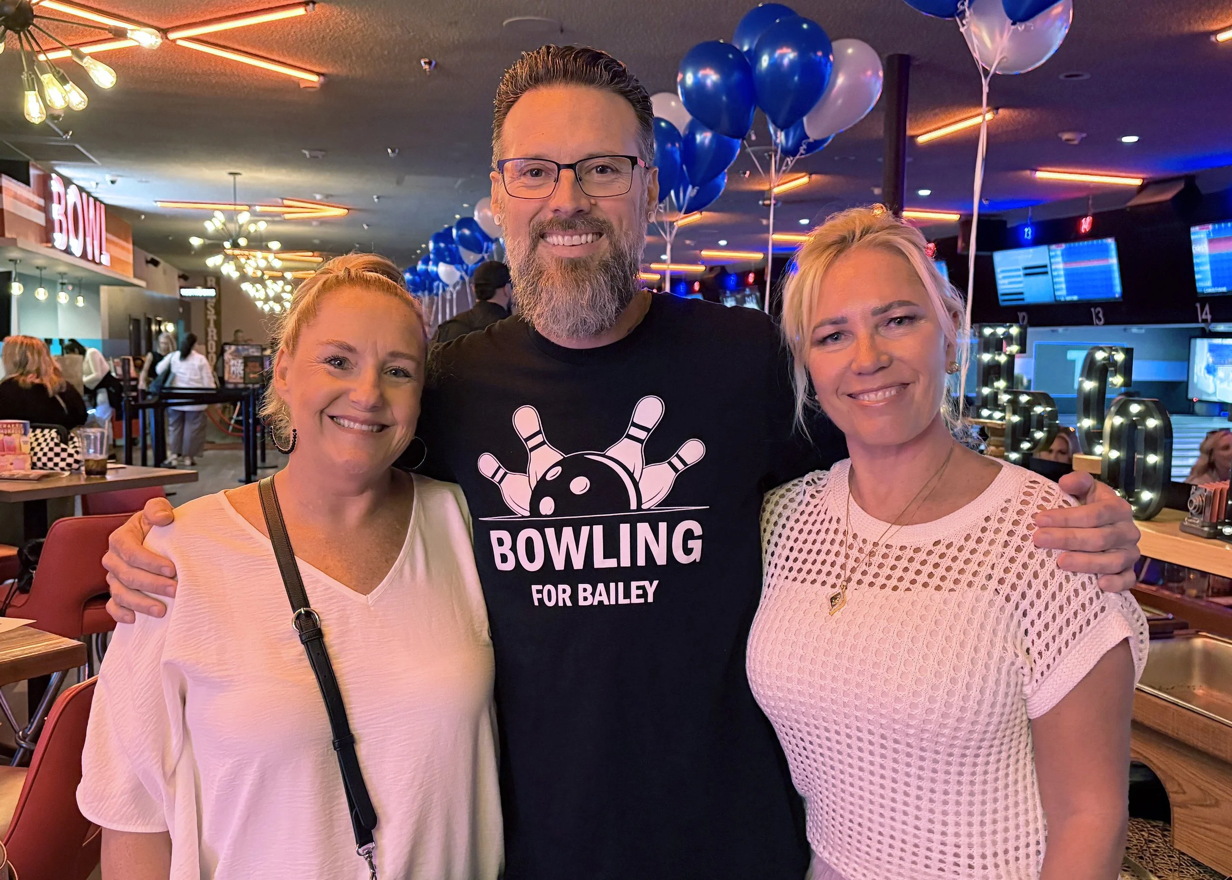 Bailey with two women in white fixed.jpg