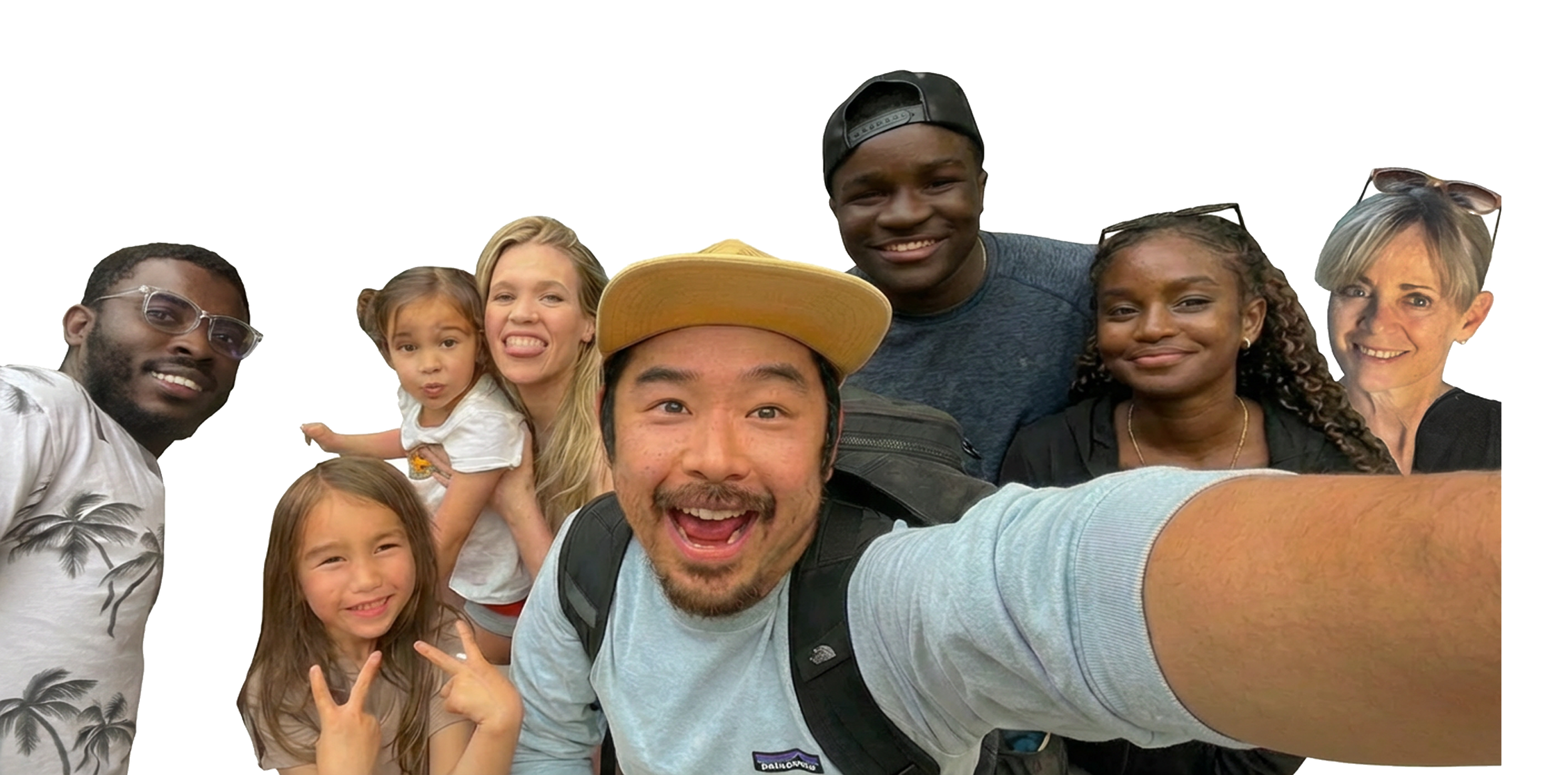 Group of diverse people taking a selfie together, smiling and making playful gestures.
