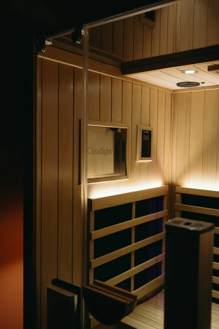 Interior of a private room with a luxurious Infrared Sauna and Red-Light Therapy Wellness Studio.