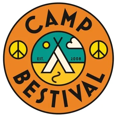 Logo for Camp Festival featuring a circular design with an orange border, black text reading 'CAMP FESTIVAL', peace symbols on each side, a central illustration of a tent, mountains, and a sun, with the text 'EST. 2008'.