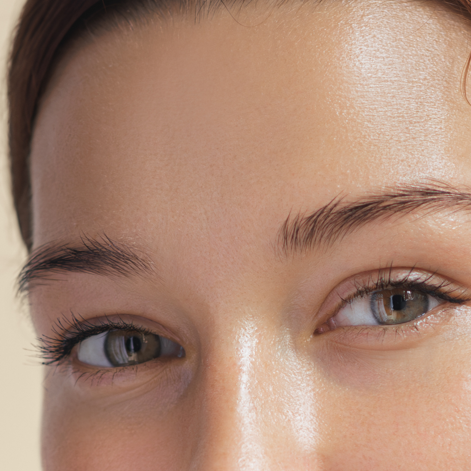 Close-up of a woman's face focusing on her eyes and forehead.