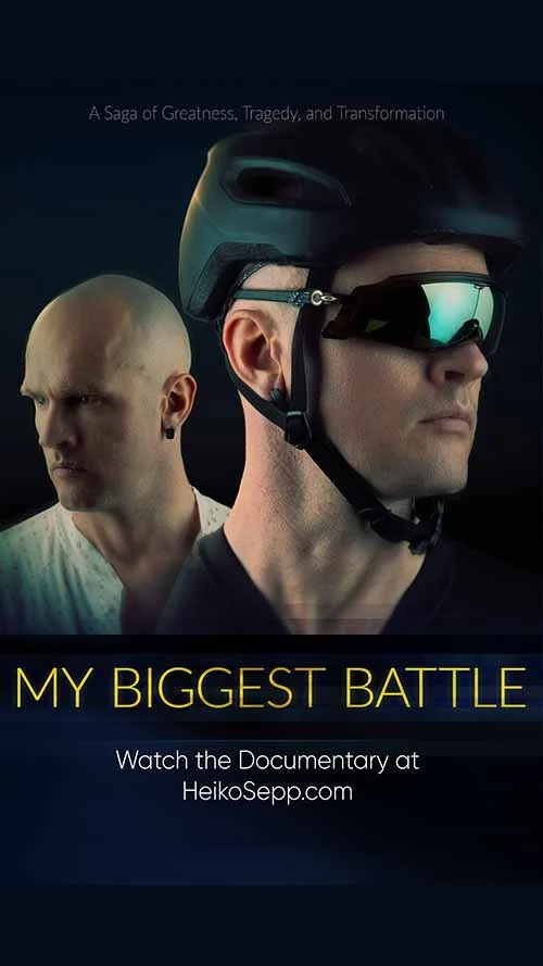 Poster for the documentary titled 'My Biggest Battle' featuring two men, one wearing a helmet and sports sunglasses, and the other with a shaved head, with the tagline 'A Saga of Greatness, Tragedy, and Transformation.'
