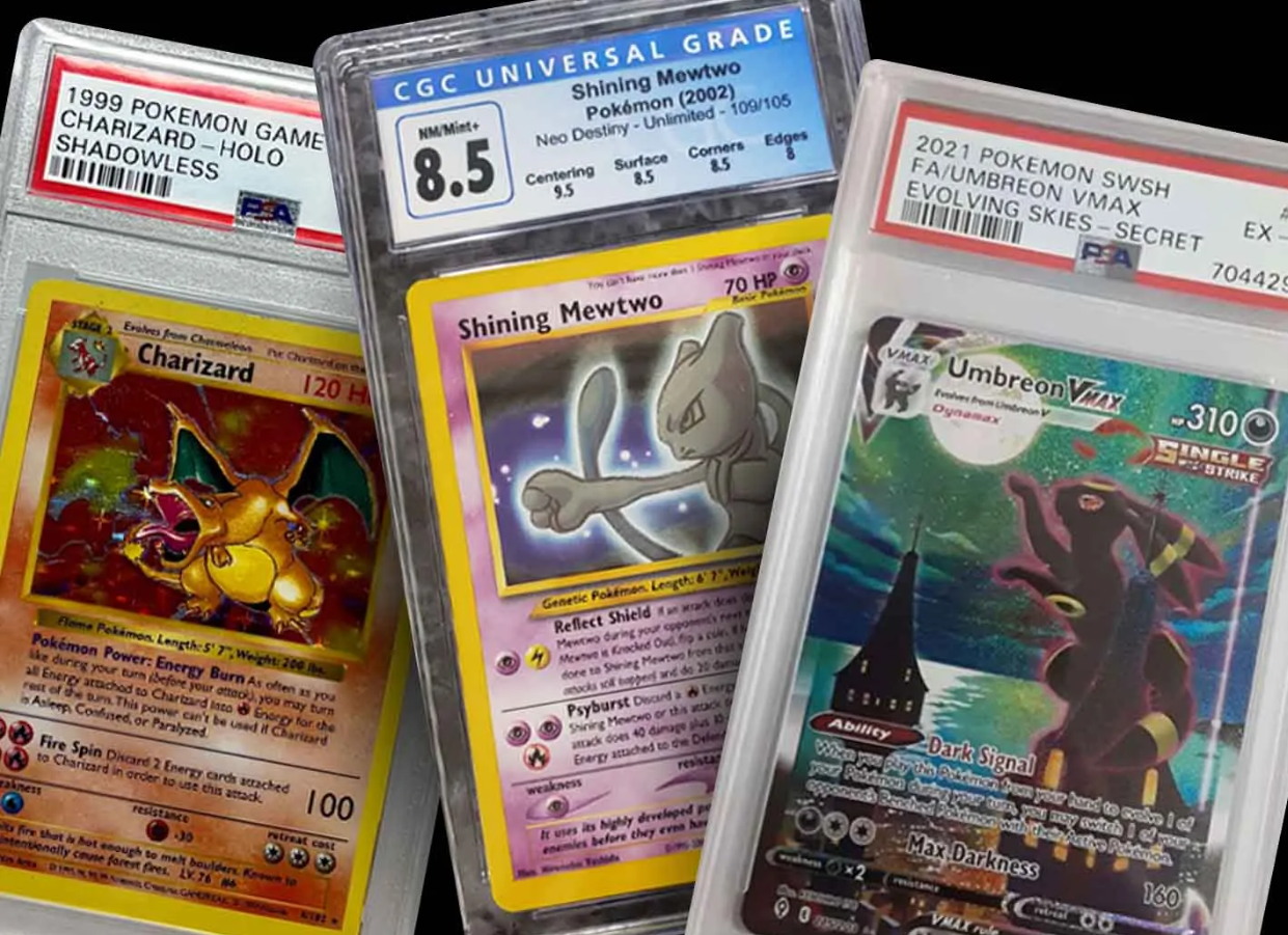 Collection of Pokémon trading cards in graded slabs, featuring Charizard, Mewtwo, and Umbreon VMAX.