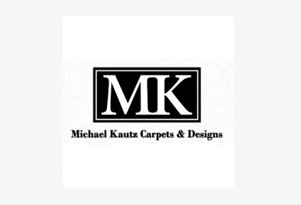 Logo for Michael Kautz Carpets & Designs featuring black and white initials MK.