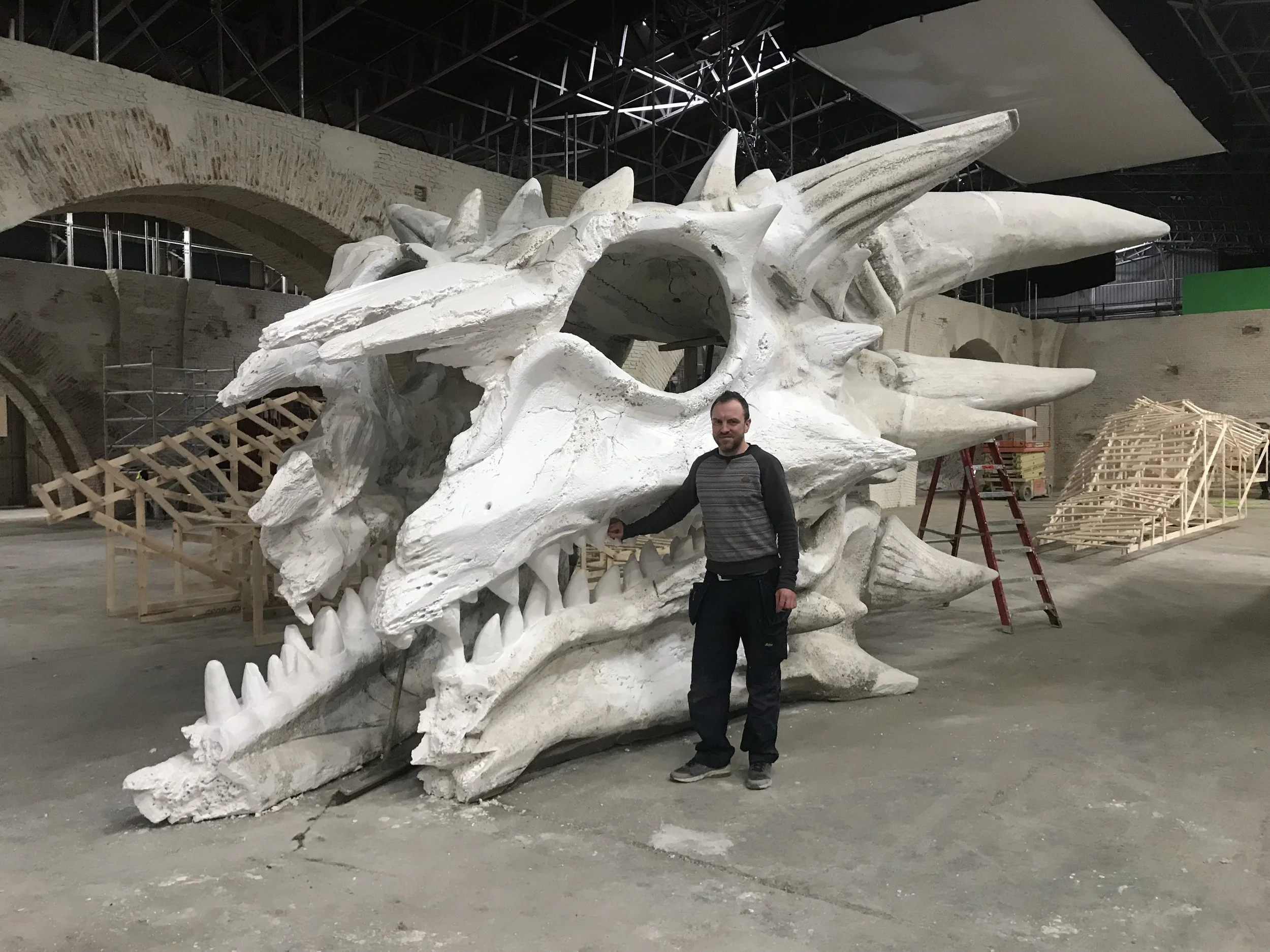 Sculptor Marc Kelly standing beside the infamous Dragon Skull that appeared throughout the Game of Thrones series. Sculp were part of the crew working on this and many other features that appeared in the Final Series