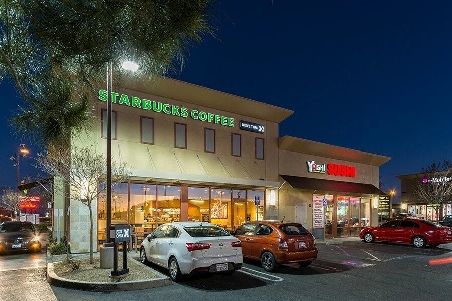 Nighttime view of a The Crossroad a boutique center at one of the busiest intersections Hesperia, CA.