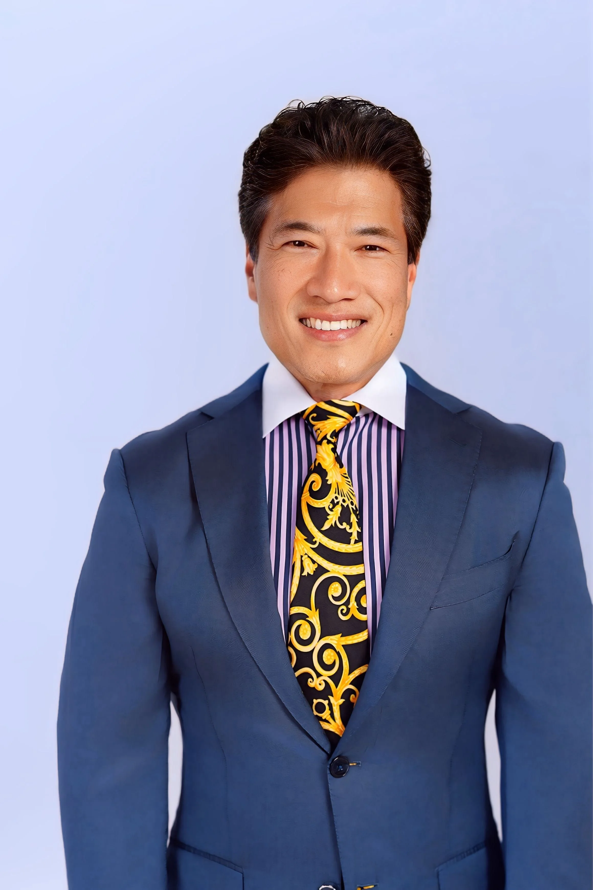 Kenneth Ro MD headshot in navy suit jacket