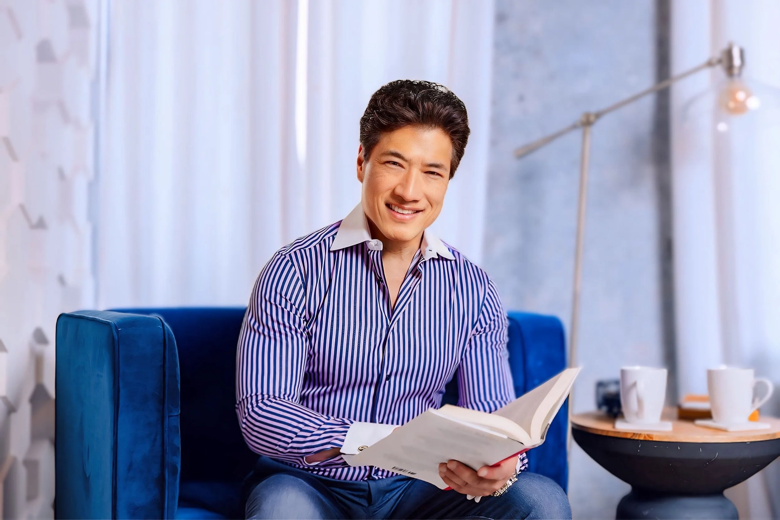 Kenneth Ro MD holding book