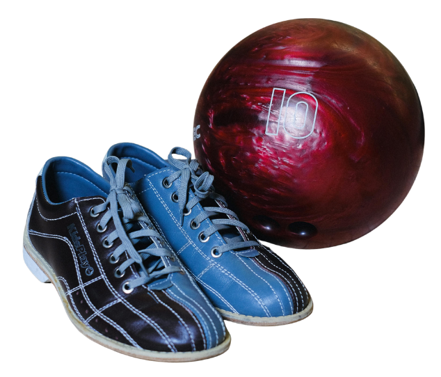 A pair of bowling shoes and a maroon bowling ball.