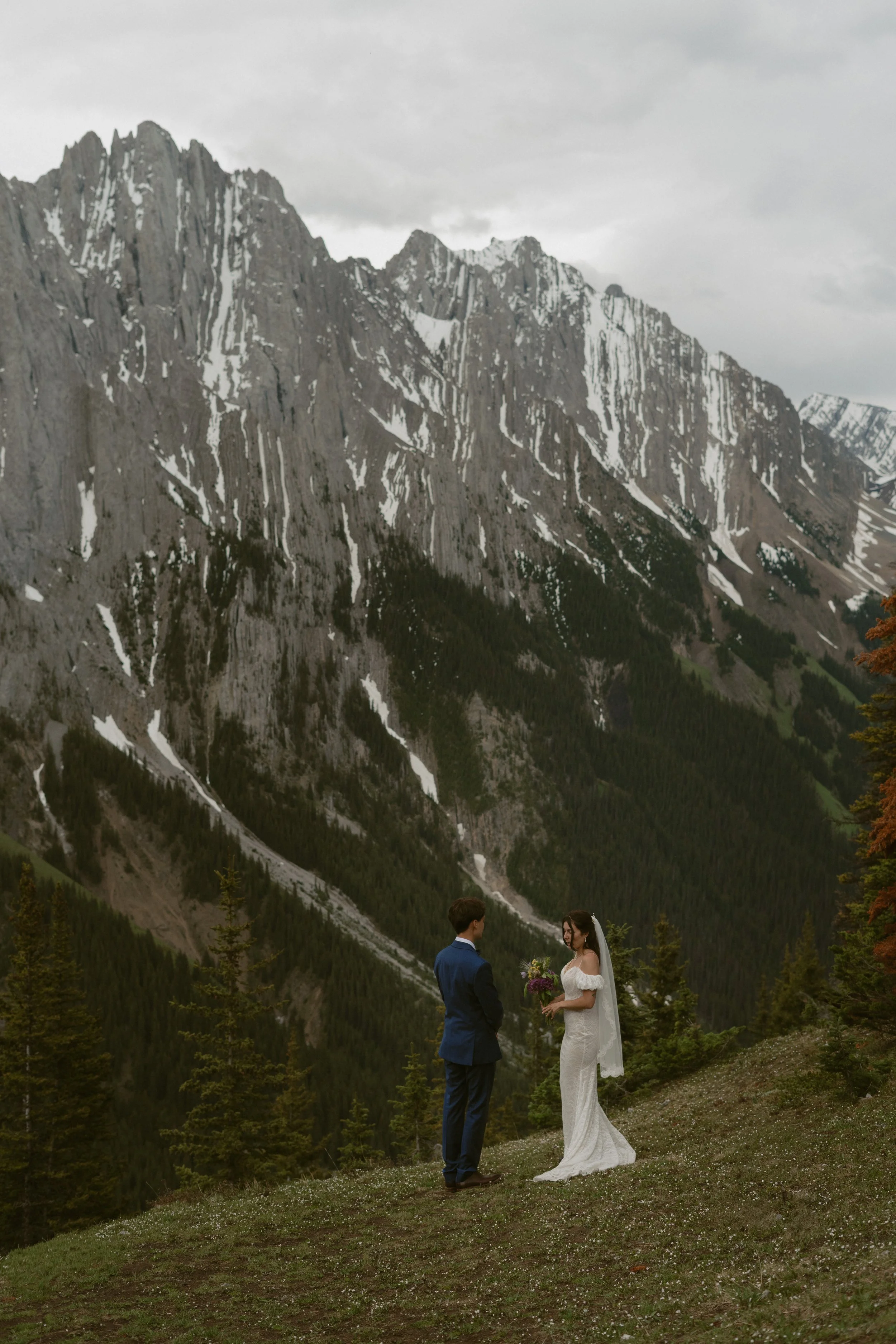 Bride and groom hiking trail elopement ceremony in Kananaskis-hiking-elopement-elopement-photographer-banff-16.jpg