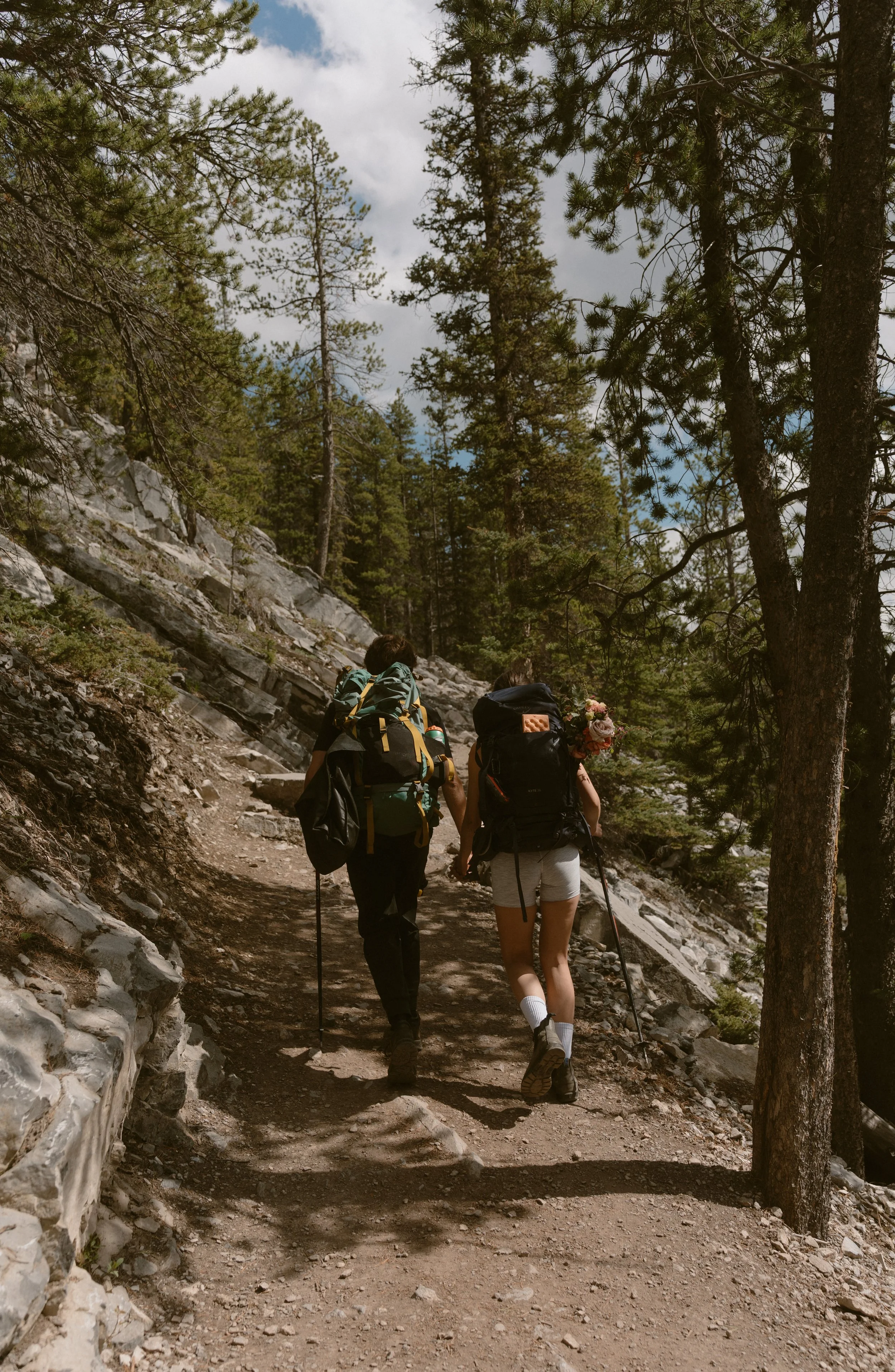 Couple hiking up Ha Ling Peak near Canmore