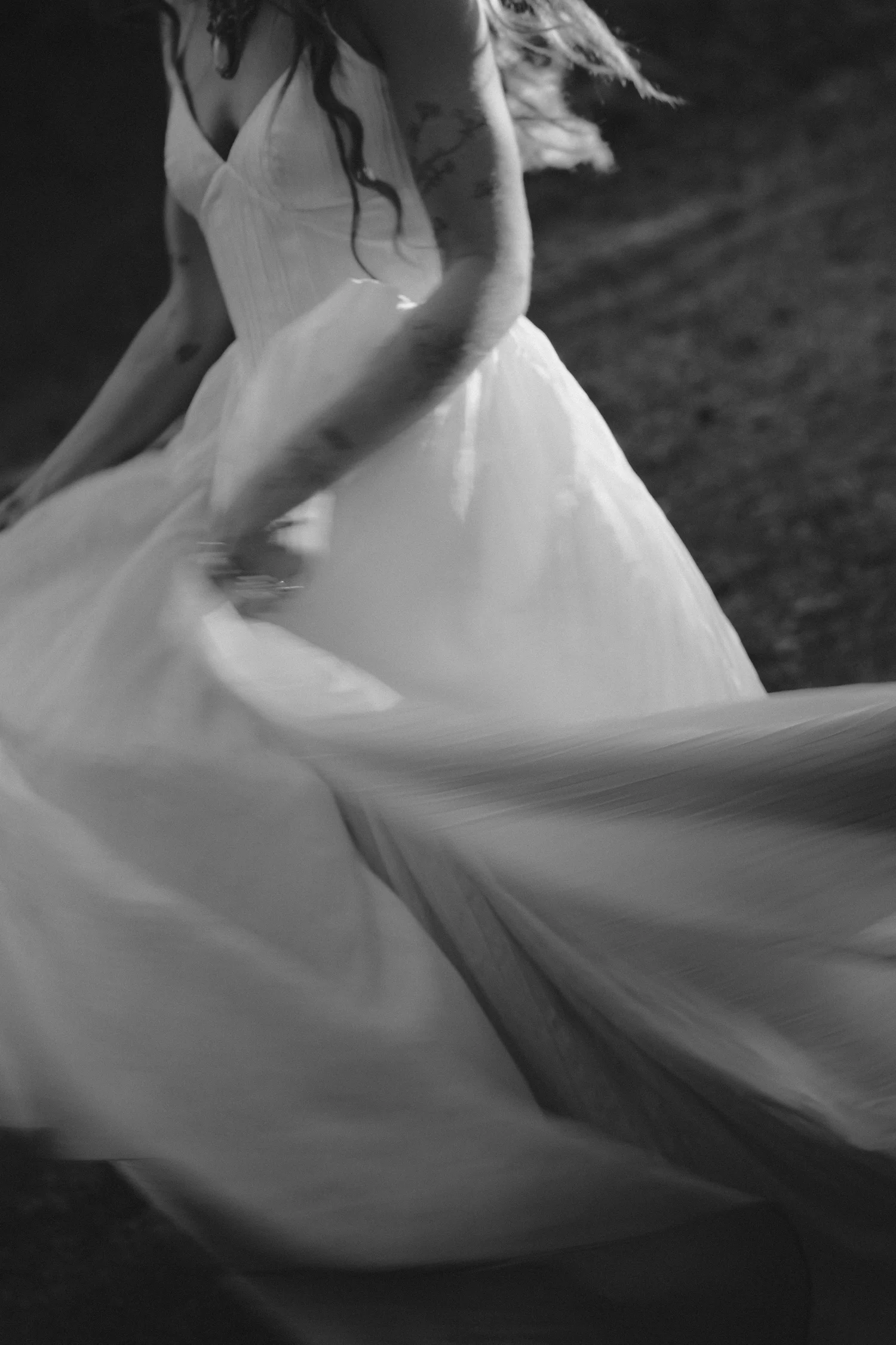 Bride moving through evening light at a Fraser Valley backyard wedding