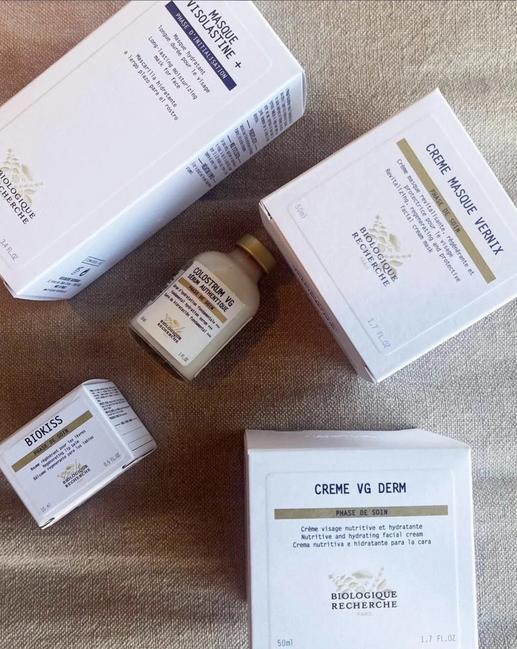 Collection of skincare products, including boxes and a small bottle, labeled in French and English, from Biologique Recherche, focusing on facial creams and serums.
