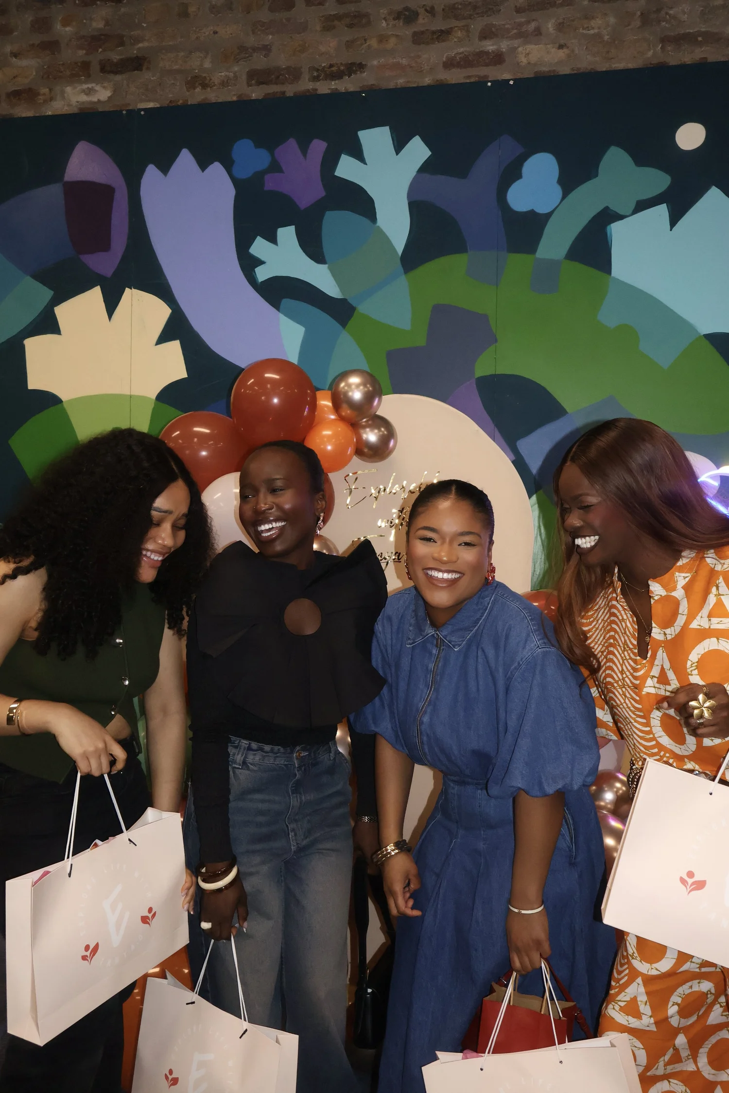 Women sharing a joyful moment at an Explore Life gathering
