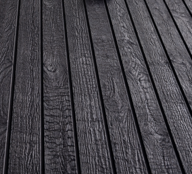 Close-up of dark, textured wooden deck planks.