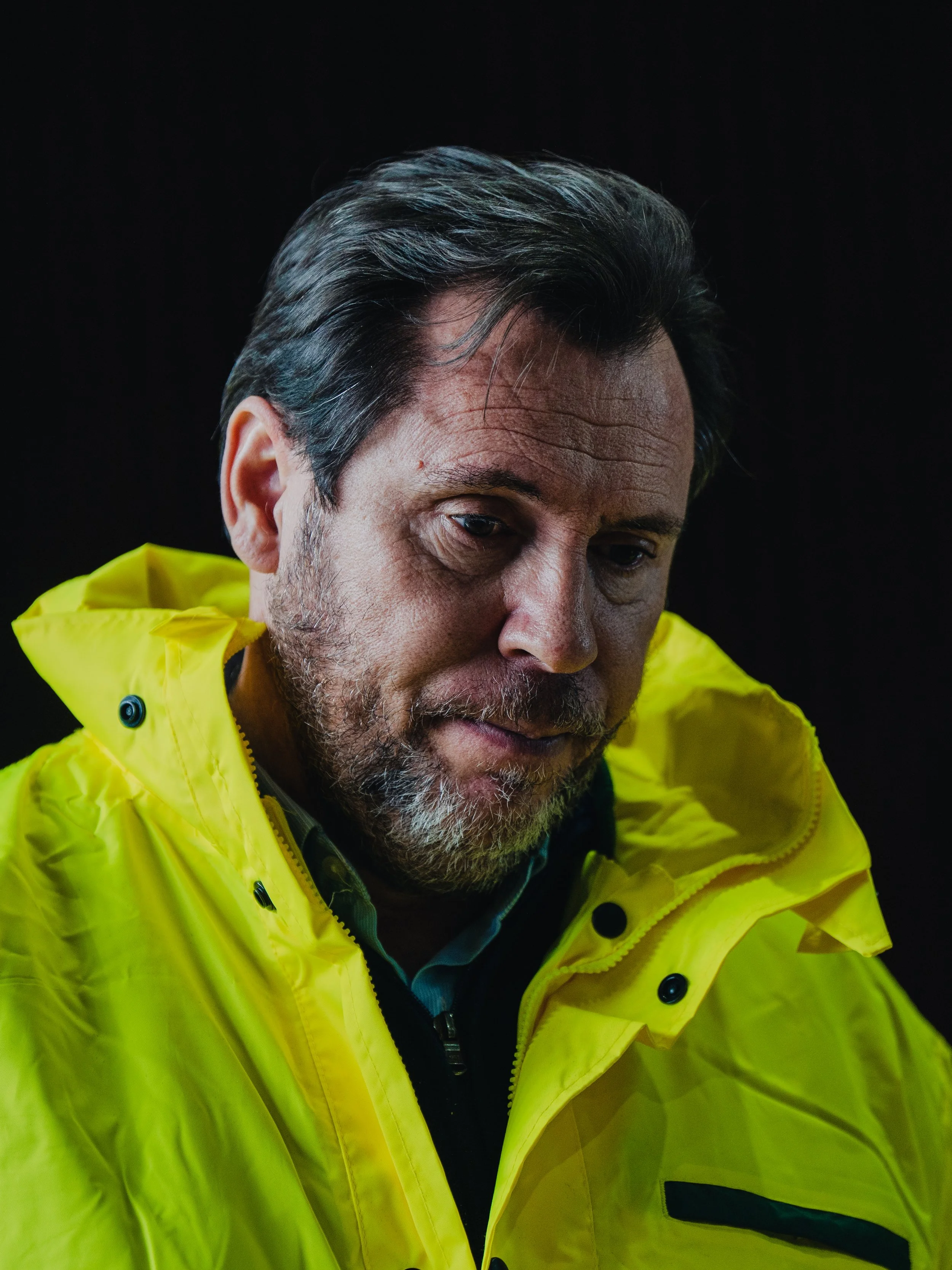 Spain’s Transport Minister Óscar Puente listens during a press conference led by Prime Minister Pedro Sánchez at the municipal pavilion in Adamuz, on January 19, 2026, a day after the train collision.