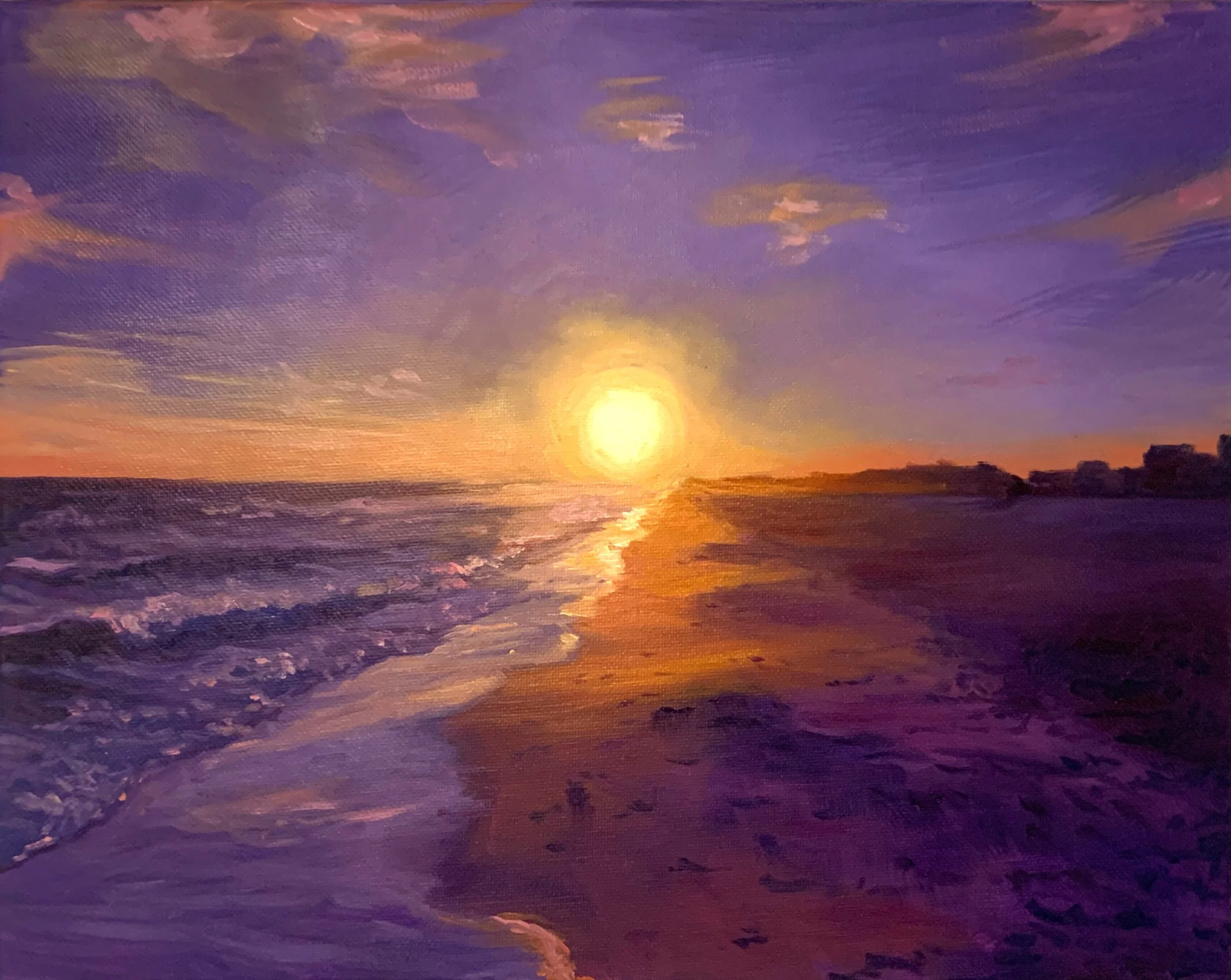A painting of a sunset over the ocean, with the sun low on the horizon casting warm yellow and orange hues across the sky and reflecting off the water. The shoreline with dark sand curves along the bottom right of the image, and clouds are scattered 